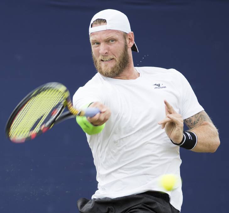 WHACK: Sam Groth suffered a nail-biting loss before serving it up to online "scum". Picture: GETTY IMAGES