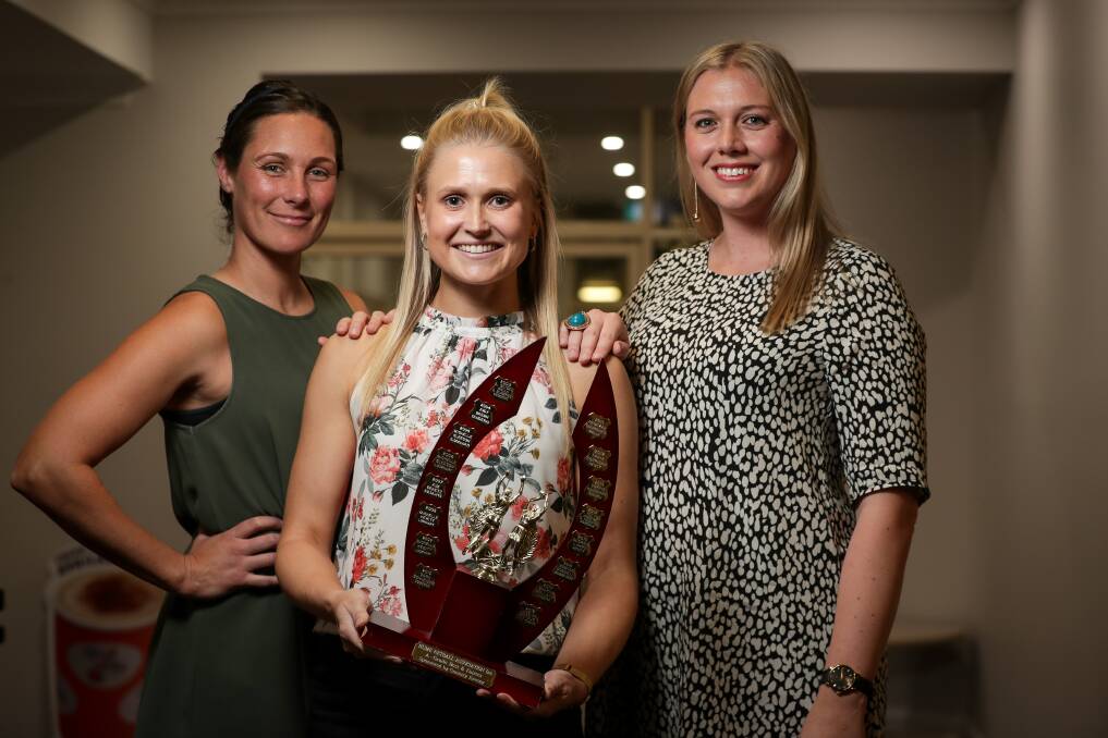TRIO OF CHAMPIONS: Former winners Beck O'Connell and Sharna Holland congratulate Jess Kotzur, centre, on her A grade best and fairest. Pictures: JAMES WILTSHIRE