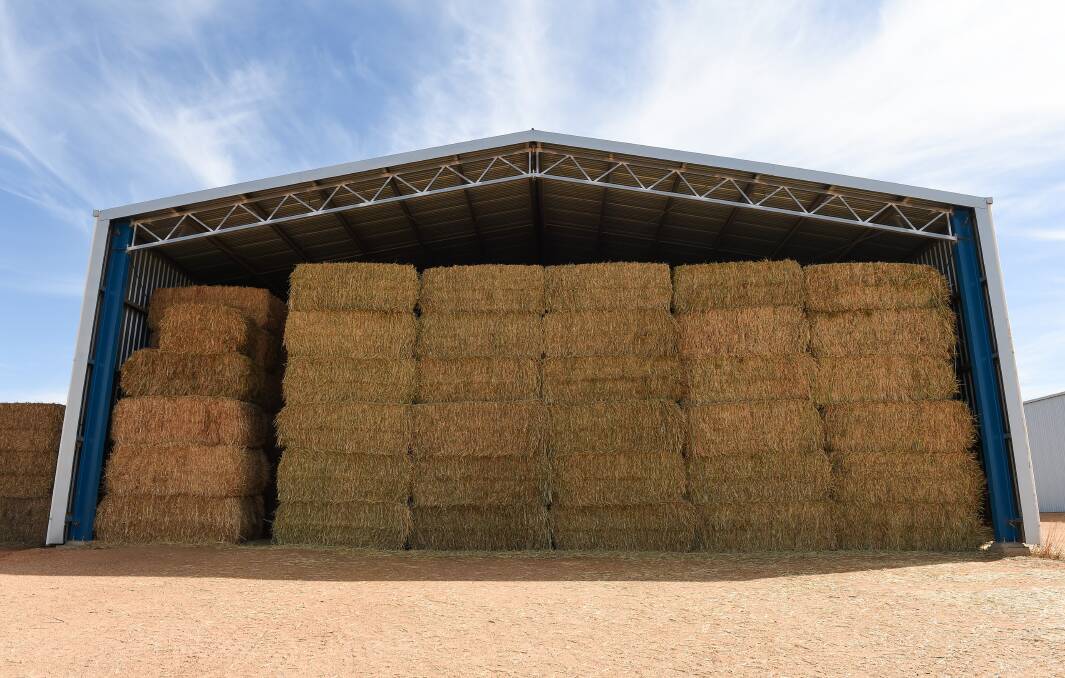FULL SHED: Howie Muller has baled about 2500 big squares and there’s still about 3000 to go - “there has been a huge demand for hay for a long time.” Pictures: MARK JESSER