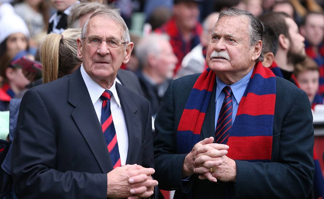 DEMON CHAMPIONS: "Hassa" Mann and Ron Barassi at a Melbourne match in 2014. Picture: GETTY IMAGES