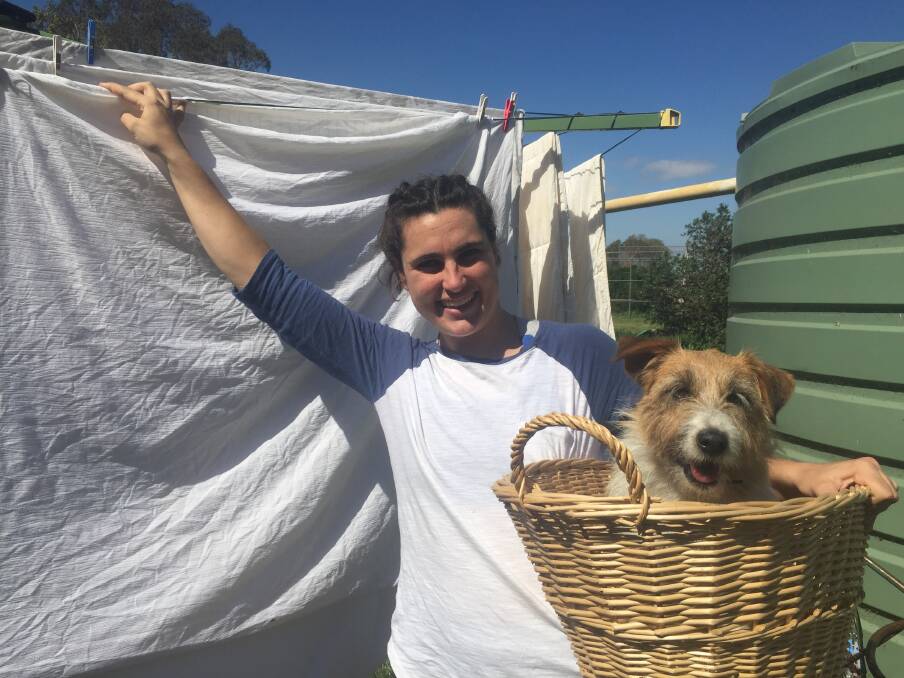 KEEPING CLEAN: Victoria Ellis and loyal helper Crozbie have been catching up on some washing in isolation.