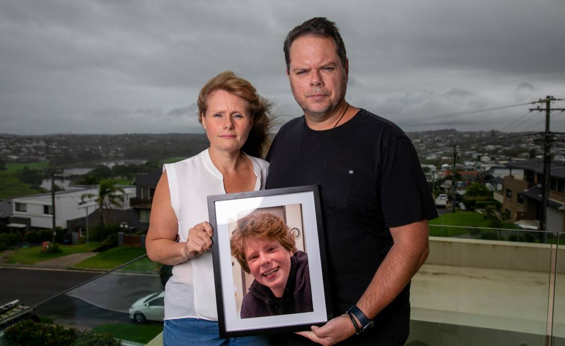 DETERMINED: Diana and Andrew Gill with a photo of their son Josh who died following a battle with mental health issues. Picture: Geoff Jones