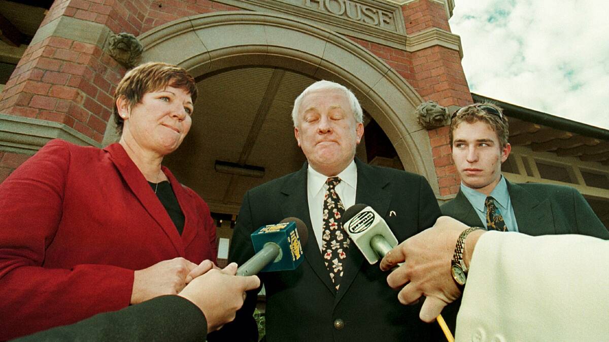 Graeme Randell Meredith (right) and his parents June and Bob Meredith outside court in Wagga in 1999.