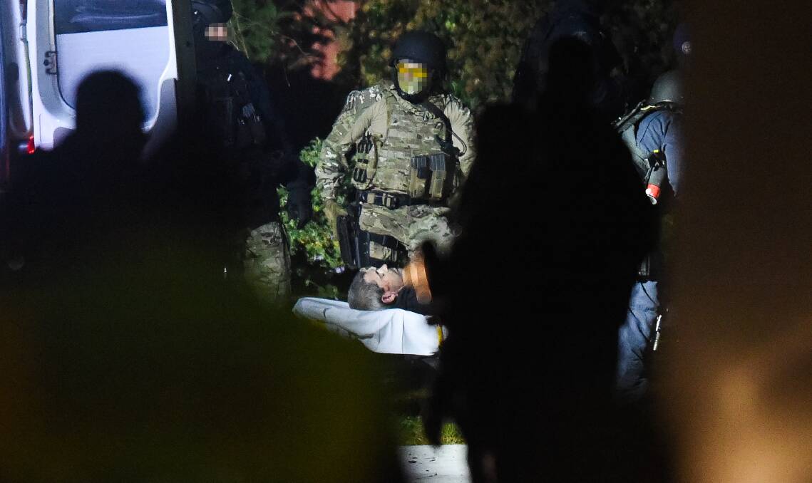 A tactical police officer outside the Jason Court on the night of the stand-off. Picture: MARK JESSER