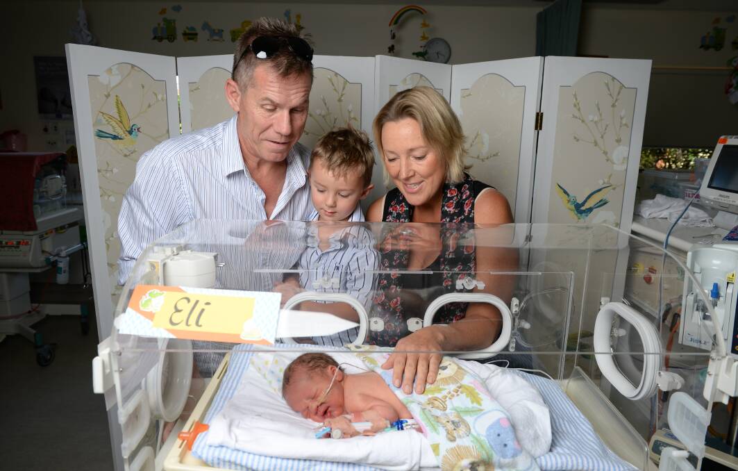 Elenor Tedenborg, her partner, Simon Bayliss, and their son Charlie, then 3, with the newborn Eli. Picture: MARK JESSER