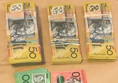 Some of the cash seized by police.