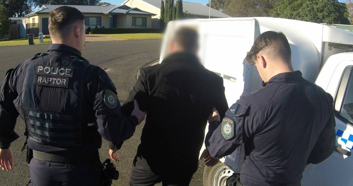 Police arrest one of the four men in July. Picture by NSW Police