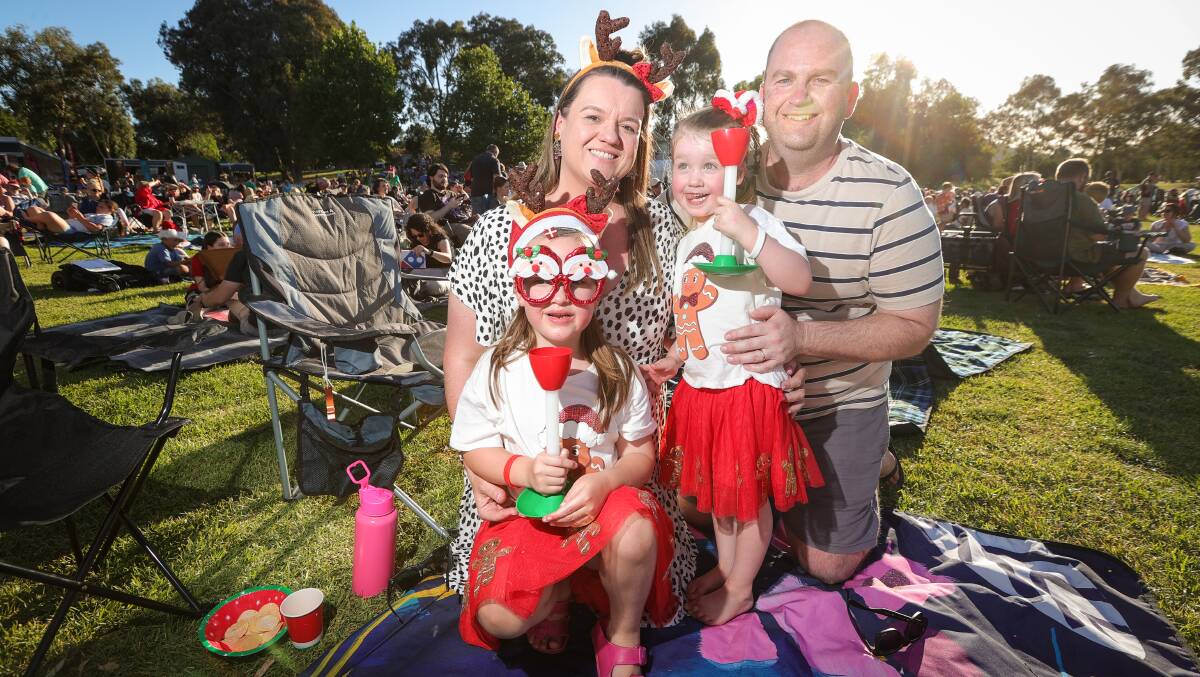 Wodonga's Matt and Brooke Ford with children Ella, 6 and Ruby, 4, got into the Christmas spirit at the Wodonga Carols by Candelight. Pictures by James Wiltshire