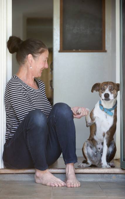 At home in North Albury with her daughter's dog, Barley. Picture: KYLIE ESLER