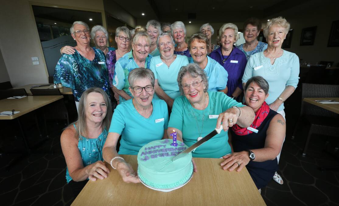 ANNIVERSARY: Shirley McCarthy and Shirley Smith cut the cake watched by their namesakes as the Shirley Club turns one. Picture: KYLIE ESLER