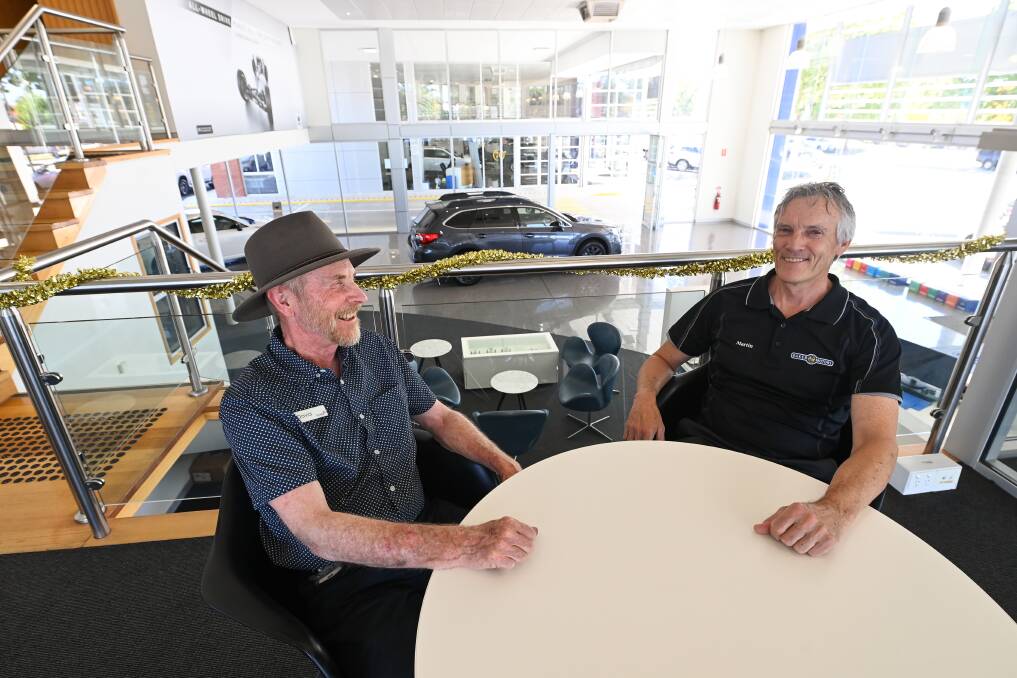 BUILDING RAPPORT: David Poole talks with Martin Baker, of Baker Motors, one of the Border workplaces he visits regularly. Picture: MARK JESSER
