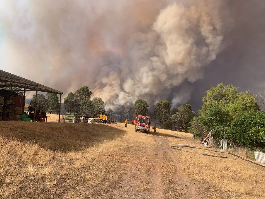 ON THE GROUND: Crews work to protect lives and properties during the Upper Murray bushfires. Picture: DAVE ROSSITER
