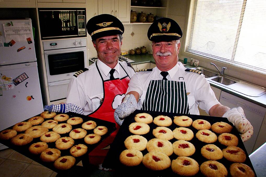 FLASHBACK: Kendell Airlines captains John Arnold and David Butlin in October 2001 with some freshly baked jam drops to hand out during flights. The story travelled internationally.
