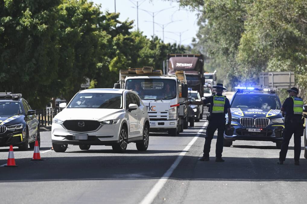 Police officers direct traffic through a random breath test operation at Wodonga's Lincoln Causeway on Friday, March 8. Picture by Mark Jesser