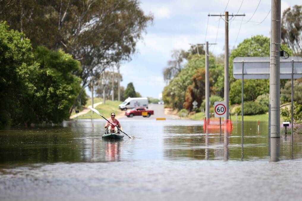 Travelling by kayak proved the best option along Barkly Street, Wahgunyah, for resident Justine Smith on Monday. Picture by James Wiltshire