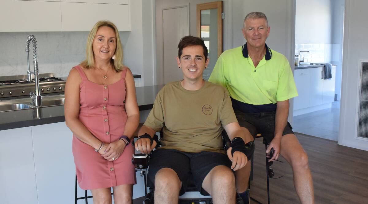 GRATITUDE: Trudy, Nick and Peter Dempsey visit the brand new Thurgoona home, which took more than a year to complete.
