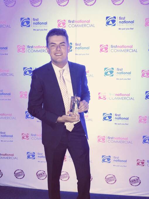 NATIONAL WINNER: Jake Spargo, of First National Real Estate Bonnici & Associates, during the award presentation at the Royal Pines Resort on the Gold Coast.