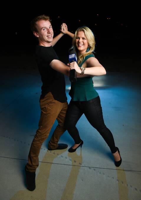 IN THE NEWS: Dance teacher Rob Baumgarten and television reporter Ashlea Kunowski practise their ballroom dancing routine, a mash-up of two dances. Picture: MARK JESSER