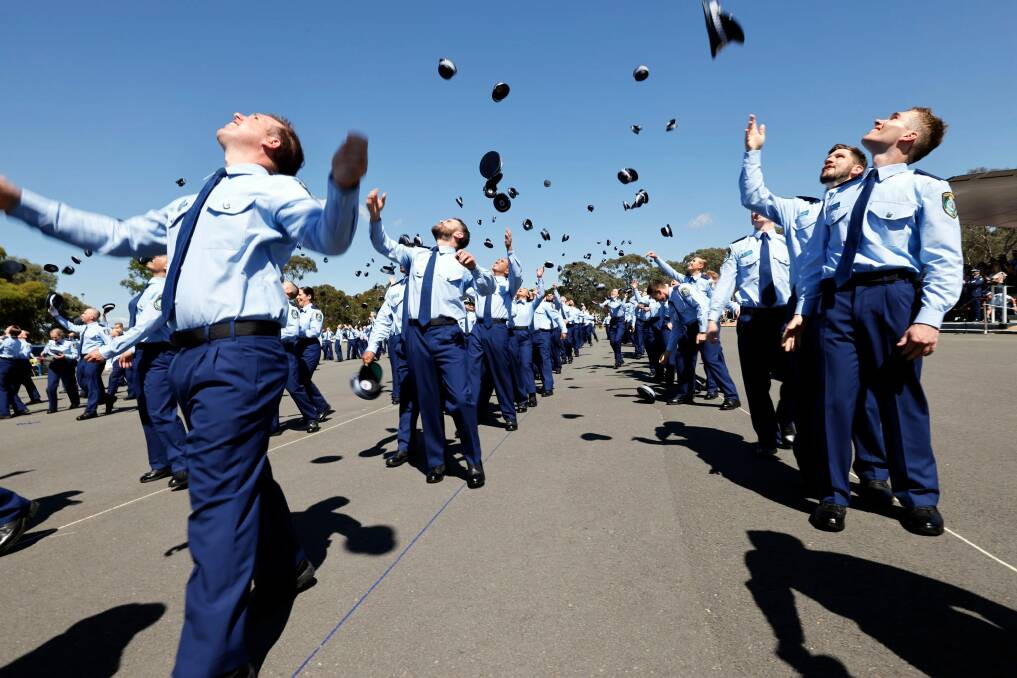 RELIEF: The throwing of hats by the new probationary constables is always a treasured part of each NSW Police attestation.