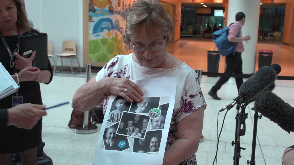 TRAGIC EVENT: Paul Kilmister's mother Christine holds photos of her loved ones during a media conference. A fundraiser will be held on Saturday, December 15, at Bundalong Tavern. Picture: FAIRFAX MEDIA   