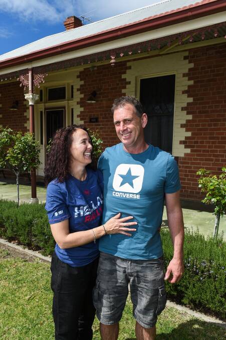 STEADY PROGRESS: Albury couple Katie and Andrew Houlihan share a laugh in October as Mr Houlihan continues to overcome the multiple fractures he sustained in a motorbike collision.
