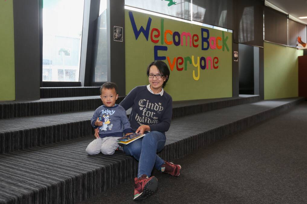 BOOK SPACE: Leo Xu, 2, and his mother Janet Liang, of Thurgoona, have been missing story time. Picture: TARA TREWHELLA