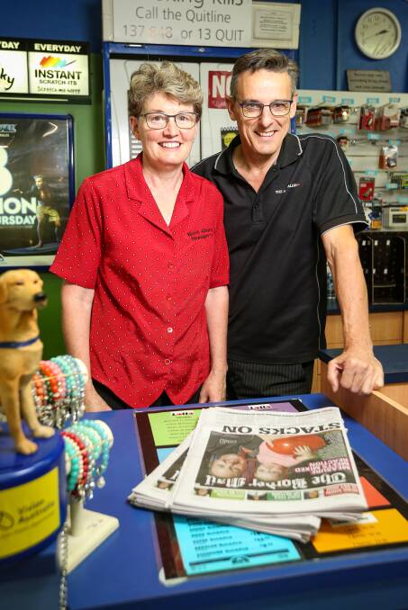 OPEN FOR BUSINESS: Jane and Barry Verbunt, of North Albury Newsagency, say people want information and occupation while they stay at home. Picture: JAMES WILTSHIRE
