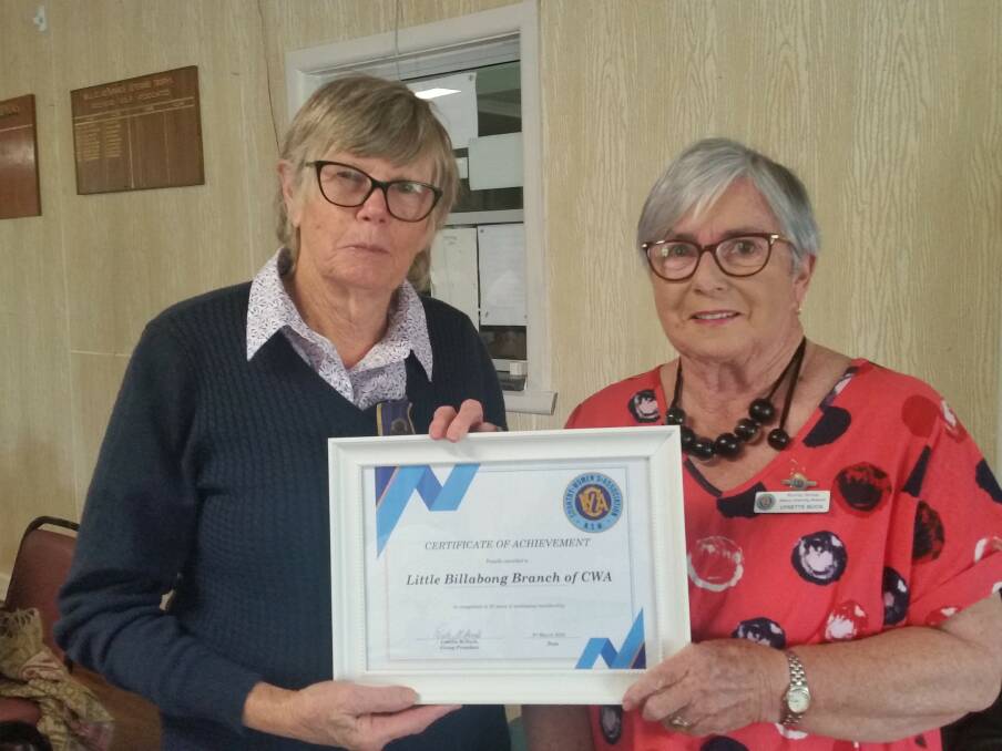 LONG SERVICE: Margaret Geddes, a foundation member of the Little Billabong CWA branch receives a certificate of appreciation for her 50 years of service to the branch from Murray group president Lyn Buck. 