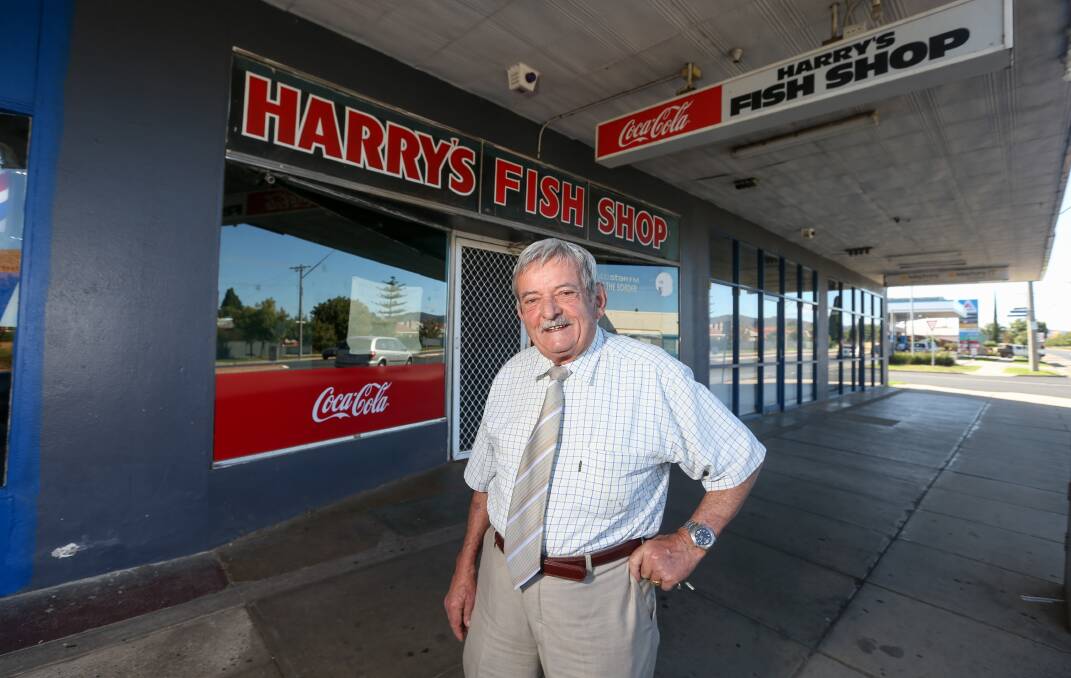 SIGN OF THE TIMES: Harry's Fish Shop founder Harry Bakouris reminisces this week outside the Mate Street business he started in 1958. The shop is now closed after more than 60 years as a meeting place. Picture: TARA TREWHELLA