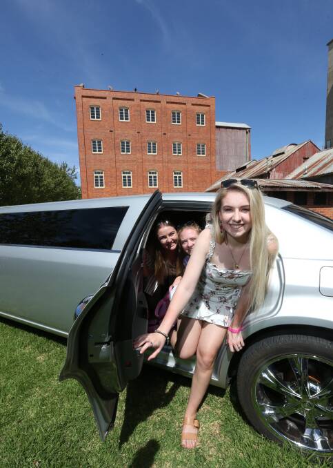 TRANSPORT: Rebecca Haines, of Albury, Shepparton's Emily Birchall and bride-to-be Natalie Andrews, of Albury, check out Albury Wodonga Limousines. Picture: KYLIE ESLER