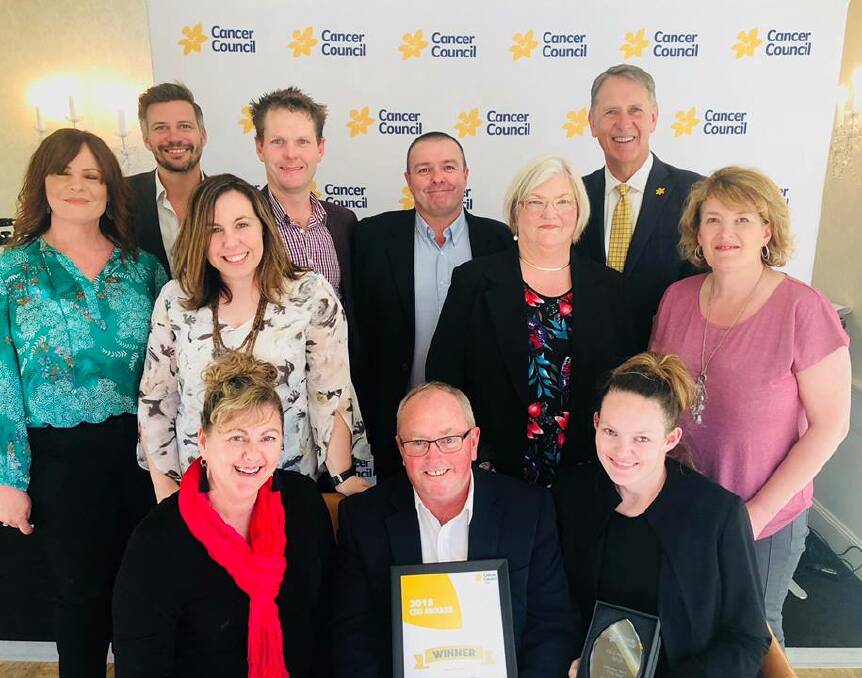 GROUP SUCCESS: Border Relay For Life committee members celebrate their victory with Cancer Council NSW representatives at Dunbar House, Watsons Bay, on Thursday.