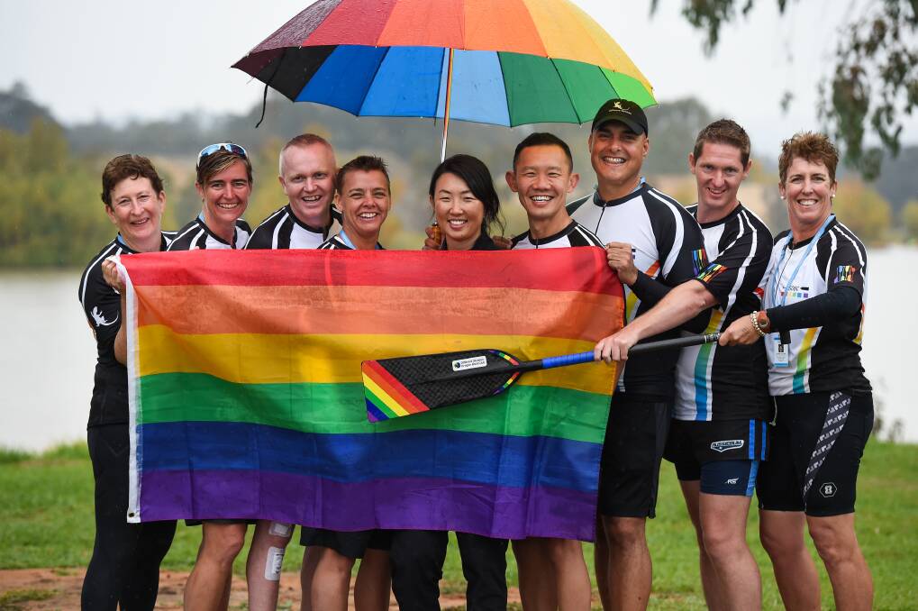 ALL TOGETHER: The team leaders of Different Strokes Dragon Boat Club are not deterred by Friday's rain at Gateway Lakes. Picture: MARK JESSER