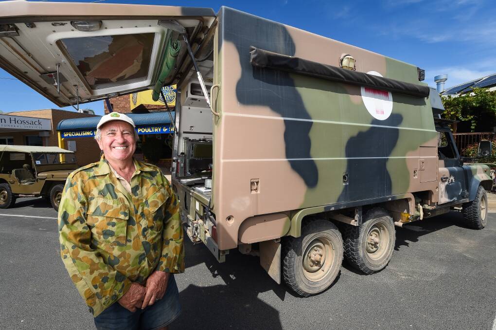 MILITARY MIGHT: Doug Gillies, of Toowoomba, joins the Howlong excursion in his 1988 Land Rover ambulance. Vehicles also visited Chiltern, Brocklesby and Wooragee, with the swim-in ending on Sunday. Picture: MARK JESSER