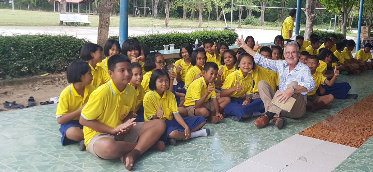 WARM WELCOME: Jos Weemaes visits primary school students in Thailand.