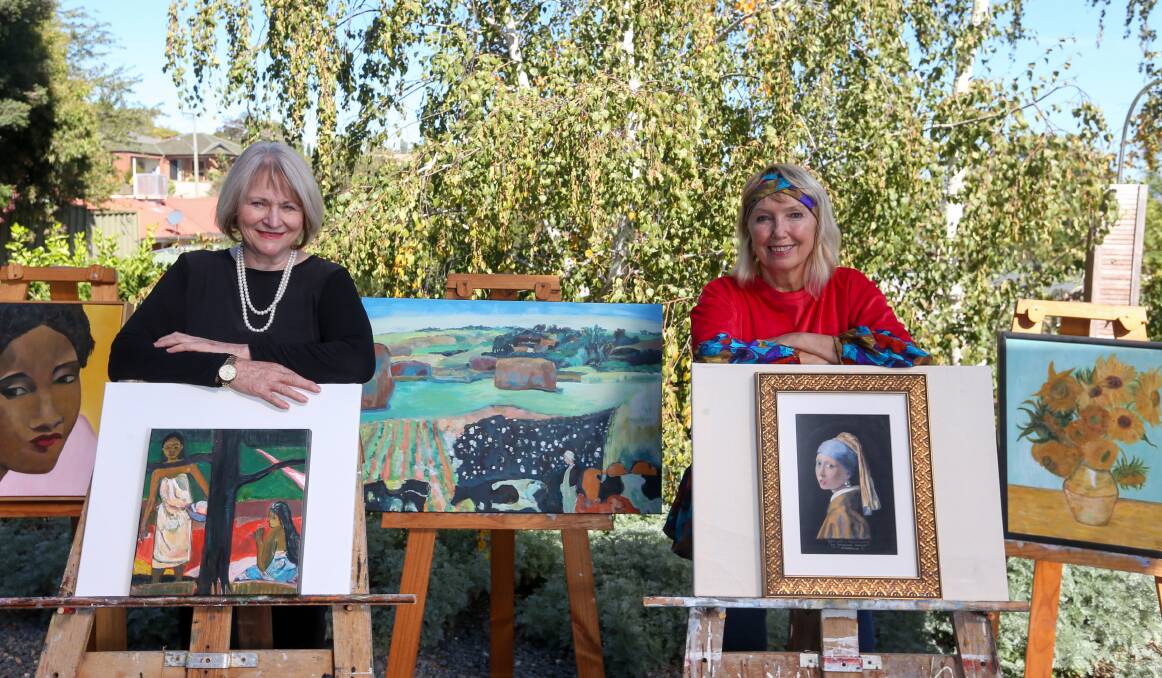 COPIES COLLECTED: Artists Meg Sprouster and Stephanie Jakovac display some of the famous fakes created for the Murray Valley Sanctuary auction. Picture: TARA TREWHELLA