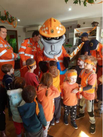 WELCOME VISITORS: Youngsters at the Community Kids Wodonga Early Education Centre enjoy meeting their special SES guests on Wear Orange Wednesday.