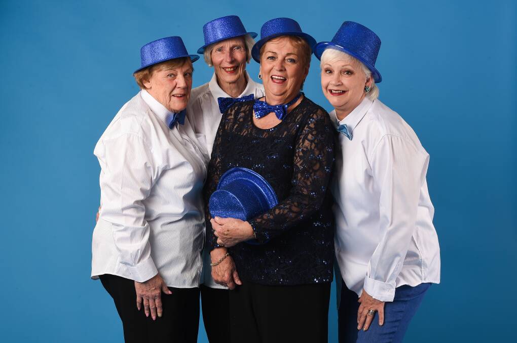 BOLDLY BLUE: Jan Smith, Yvonne Bensley, Maggie Glasgow and Karen Rose embrace the Blue Tie Ball colour scheme. Picture: MARK JESSER