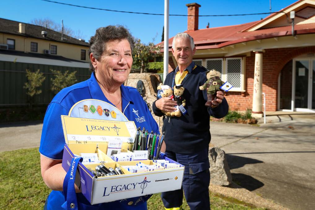 EVERY BIT HELPS: Albury Legacy appeal co-ordinator Kay Polsen and president David Turner with items being sold to support the group's work. Picture: JAMES WILTSHIRE