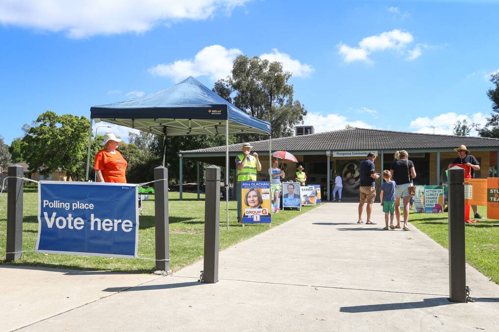 ELECTION DAY: The sun shines on Saturday as voters enter Thurgoona Community Centre to cast their ballot in the Albury council elections. Picture: JAMES WILTSHIRE