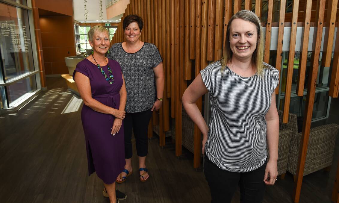 PLEASE CONSIDER: Wodonga foster carer Kelly Stokes (front) and UMFC's Maria O'Reilly and Jeanine Aughey hope more people will be encouraged to become foster carers. Picture: MARK JESSER