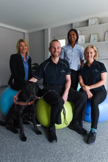 MOTIVATION: Physio Dan Searle with dog Frodo and some colleagues from Inspire Health, Tracy Wallace, Thanuja Vanderhoek and Fleur Cunningham. Picture: MARK JESSER