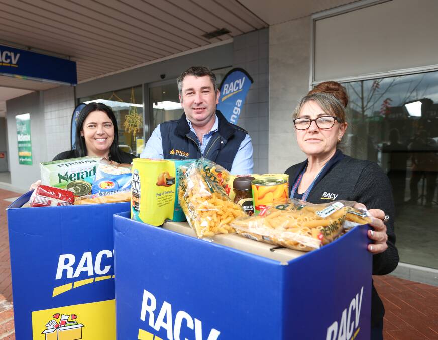 COMMUNITY CARE: RACV Wodonga's food drive has begun, with Donna Moroz, Brett Emo, of Solar Integrity, and Sonia King supporting the cause. Picture: JAMES WILTSHIRE