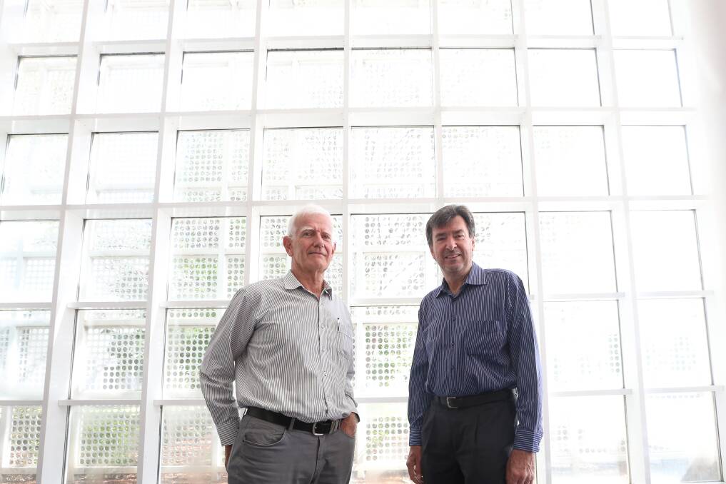 LONG CAREERS: Retiring architects Rob Simmons and Kevin Debnam prepare to pass the baton. Picture: JAMES WILTSHIRE