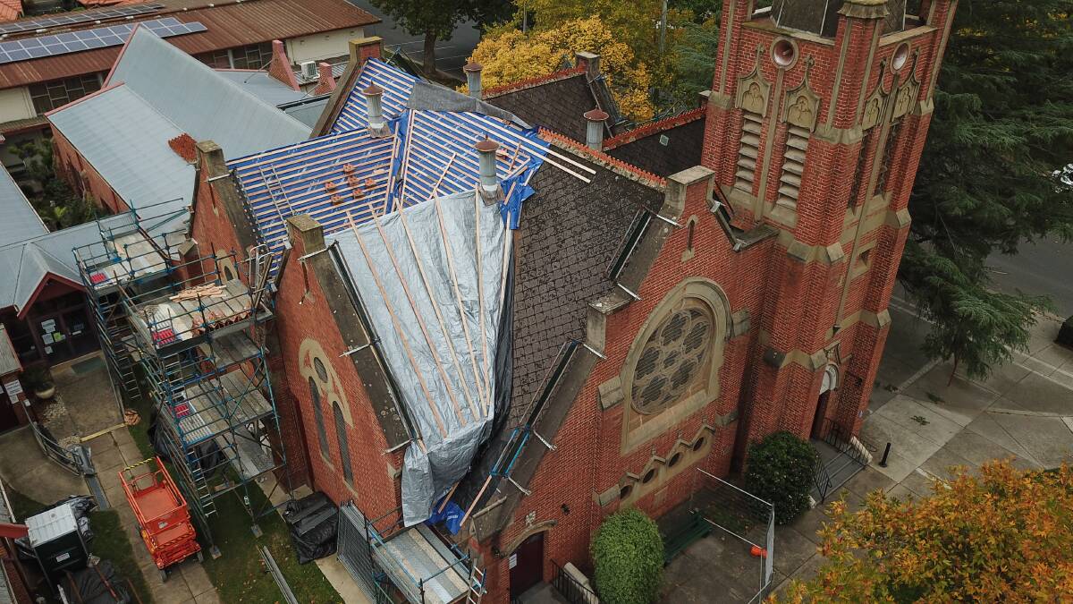 SPECIAL CARE: The church roof lies exposed as tiles laid about 115 years ago are removed. Planning the project has taken a couple of years. Picture: MARK JESSER