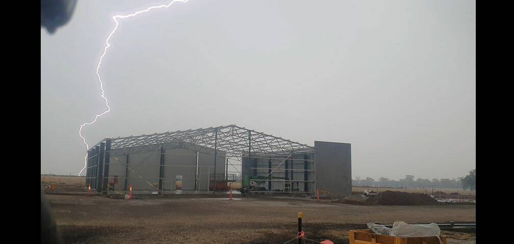 LIGHTNING STRIKE: The team from Yackandandah Engineering is considering indoor work on Monday after snapping this photo at Morris Wines, Rutherglen. Picture: JASON STRAUSS