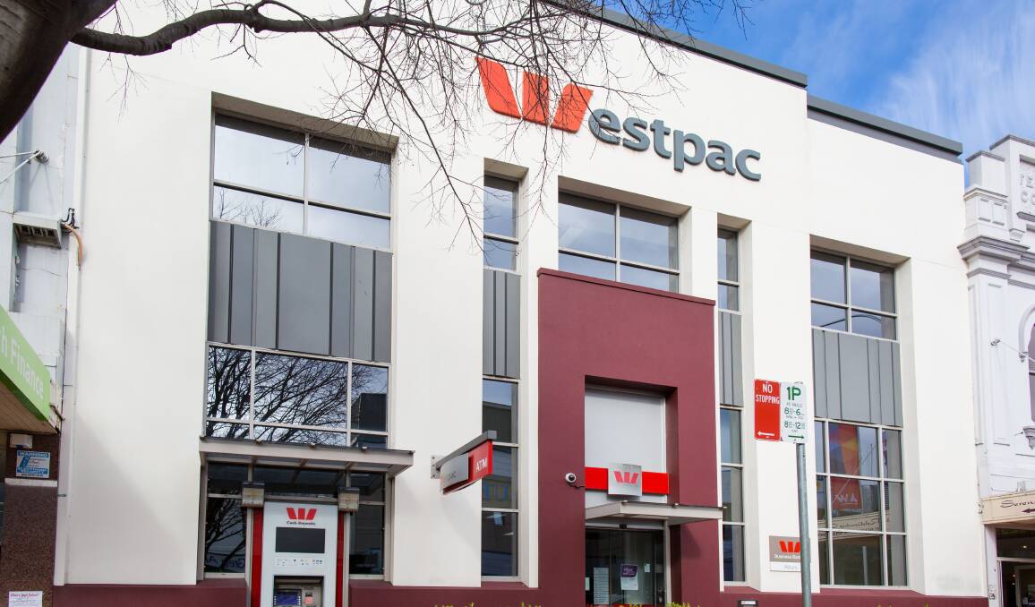 ALL DONE: It took 15 minutes and 57 bids to find a new owner for 613 Dean Street, Albury, a two-storey brick building long known as the home of Westpac Bank.