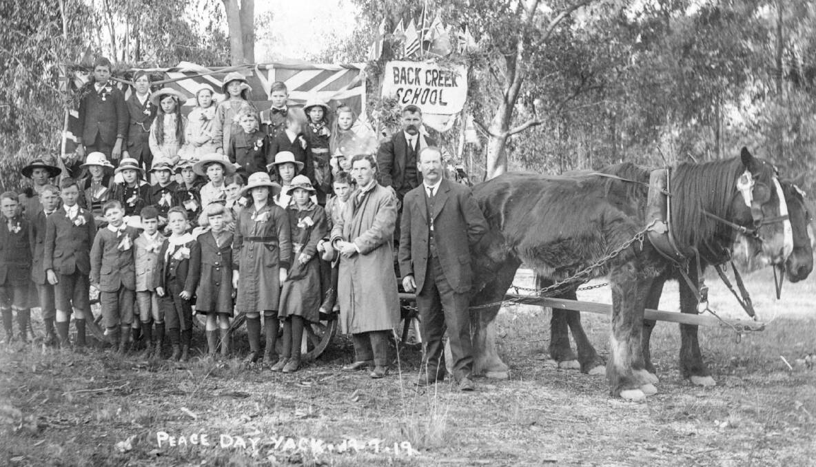 MOMENT IN TIME: The Back Creek Peace Day contingent in front of the Back Creek State School on Saturday, July 19, 1919. Supplied picture courtesy of Noel Jackling.