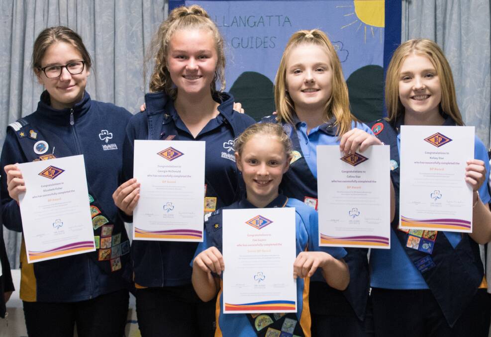PRESENTATION: Tallangatta Girl Guides Beth Fisher, Georgia McDonald, Celina Star, Kelsey Star (BP Awards, all 14) and (front) Zoe Sayers (Junior BP Award, 10) receive their honours.