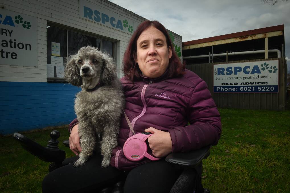FINAL EFFORT: Albury RSPCA volunteers like Kate Fiedler, here with her dog Gabby, don't want to close the branch but fear they will have no choice. Picture: MARK JESSER