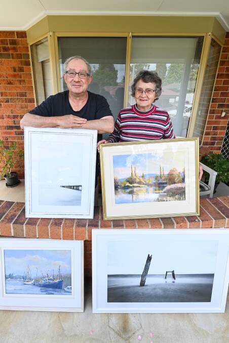 FAMILY CREATIVITY: John Osmond and his mother Jo display some of the works to be exhibited in Saturday's fair at St David's Uniting Church, Albury. Picture: MARK JESSER